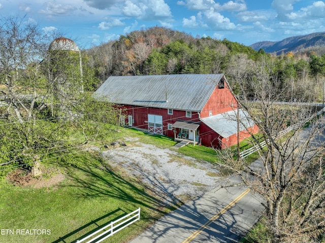 birds eye view of property with a mountain view