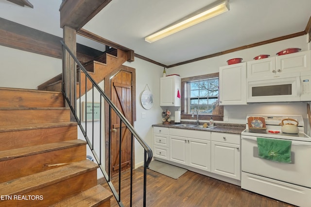 kitchen with dark hardwood / wood-style flooring, white appliances, crown molding, sink, and white cabinets