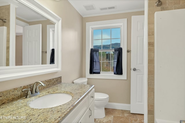 bathroom with vanity, toilet, and crown molding