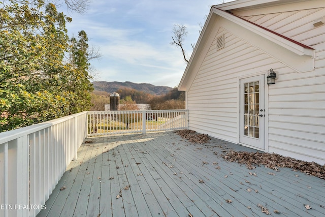 wooden terrace with a mountain view