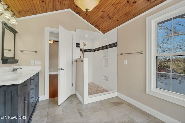 bathroom with vanity, vaulted ceiling, ornamental molding, walk in shower, and wood ceiling