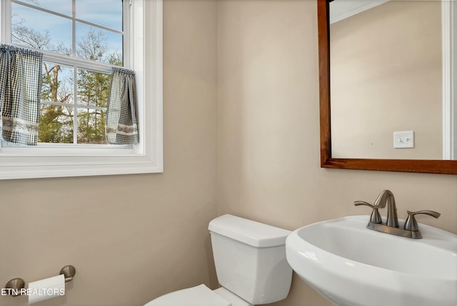 bathroom with toilet and sink