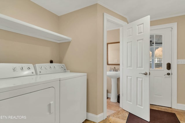 clothes washing area with washer and clothes dryer