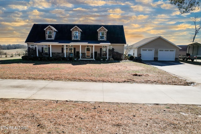 cape cod home featuring a carport and covered porch