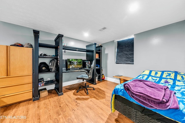 bedroom featuring wood-type flooring