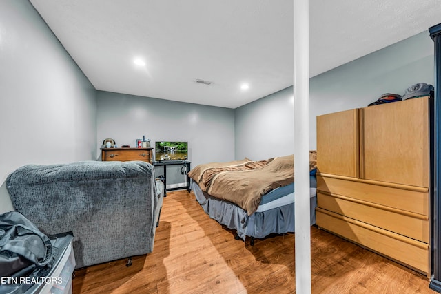 bedroom featuring wood-type flooring