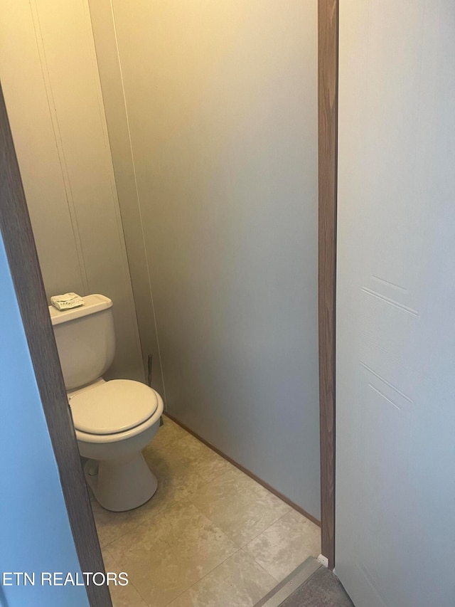 bathroom with tile patterned floors and toilet