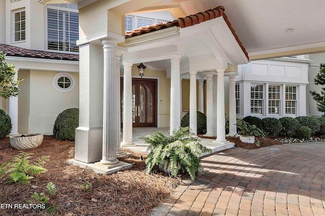 entrance to property featuring a porch