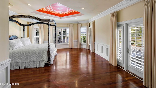 bedroom with dark hardwood / wood-style flooring, access to outside, and ornamental molding