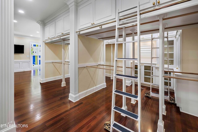 walk in closet featuring dark hardwood / wood-style floors