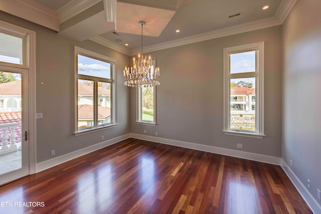 unfurnished dining area with dark hardwood / wood-style flooring, crown molding, and an inviting chandelier