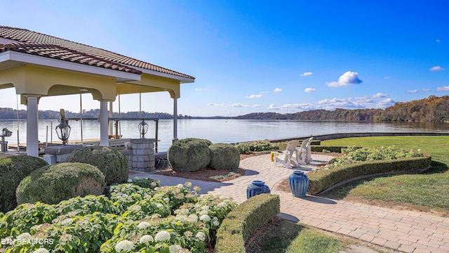 view of patio with a water view