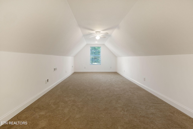 bonus room featuring ceiling fan, carpet, and lofted ceiling