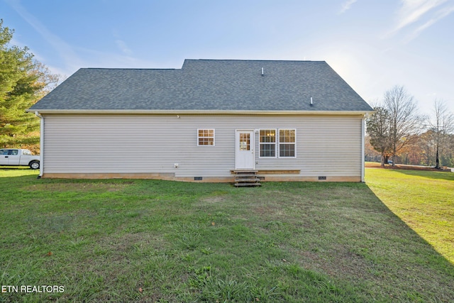 back of house with a yard