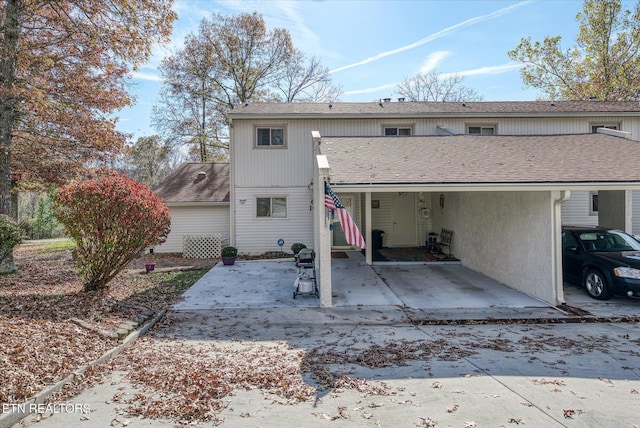 view of front of home with a carport