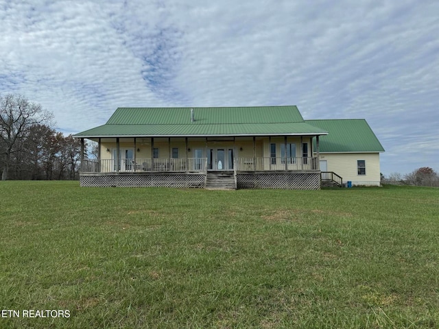 country-style home with covered porch and a front lawn