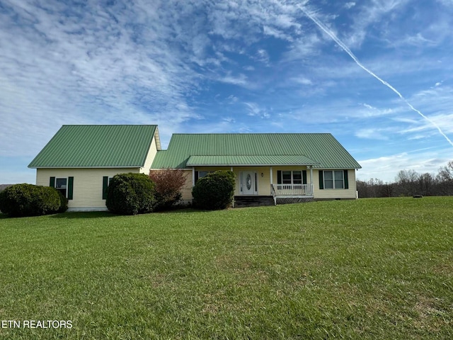 view of front of property with covered porch and a front yard