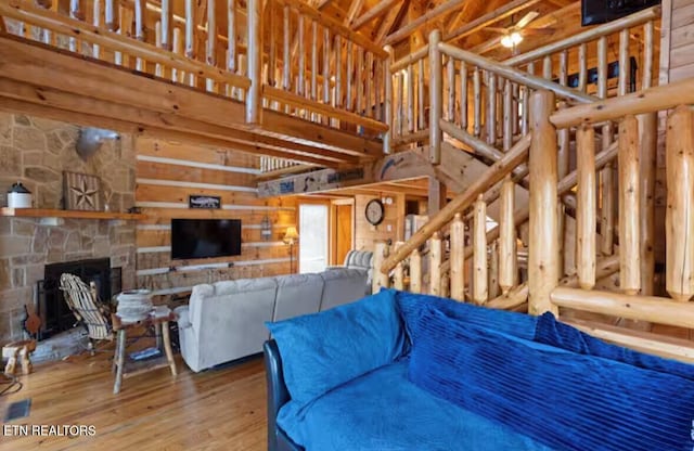 living room with a fireplace and hardwood / wood-style flooring