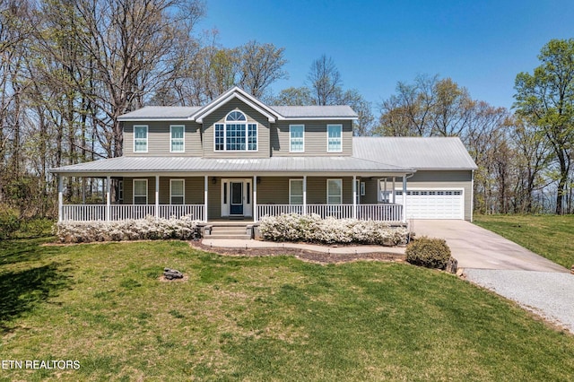 farmhouse featuring a porch, a garage, and a front lawn