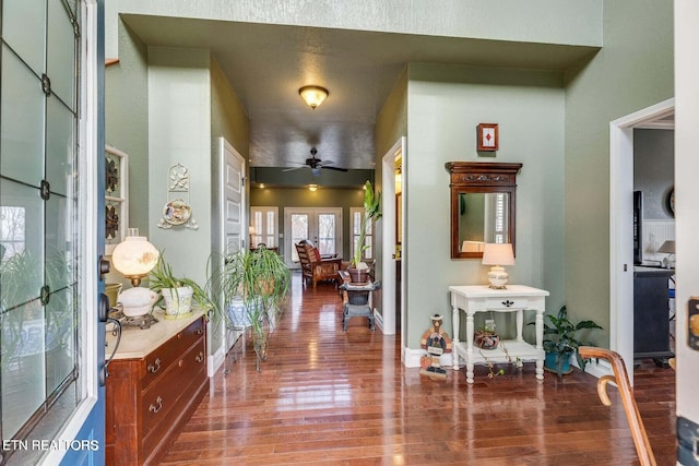 entrance foyer featuring ceiling fan, french doors, and hardwood / wood-style flooring