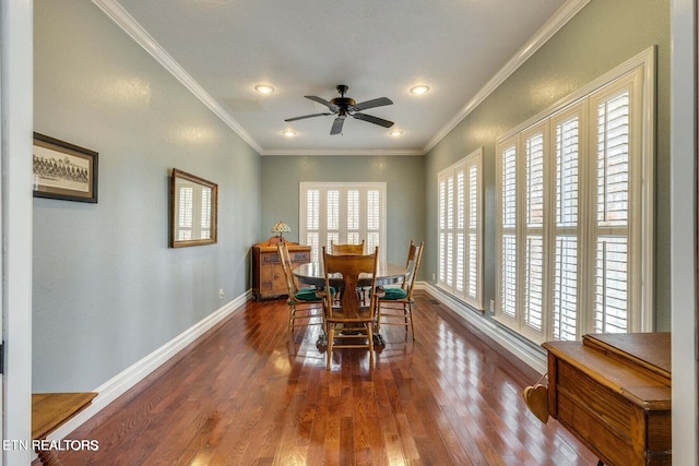 dining room featuring ornamental molding, dark hardwood / wood-style floors, and a healthy amount of sunlight