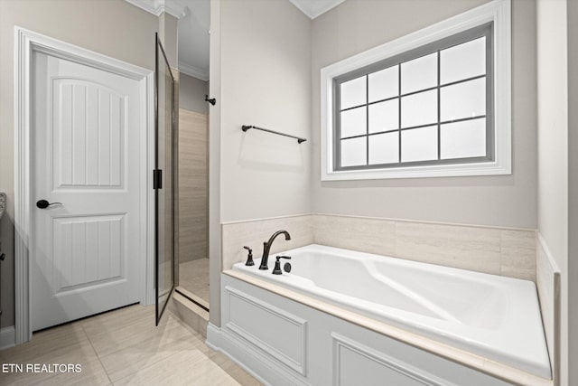 bathroom featuring separate shower and tub and ornamental molding