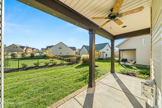 view of patio featuring ceiling fan