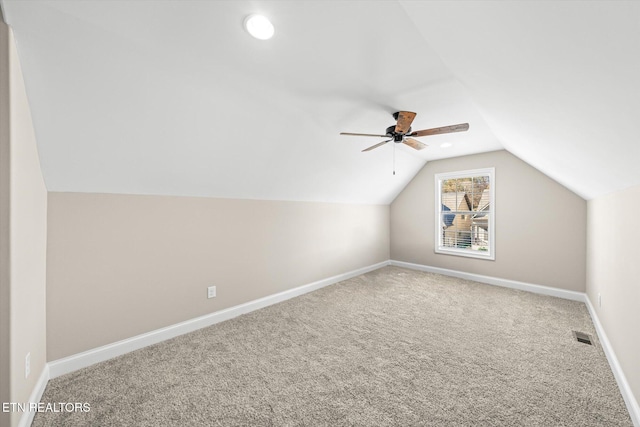 additional living space with carpet, ceiling fan, and vaulted ceiling