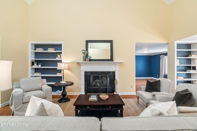 living room featuring hardwood / wood-style flooring and high vaulted ceiling