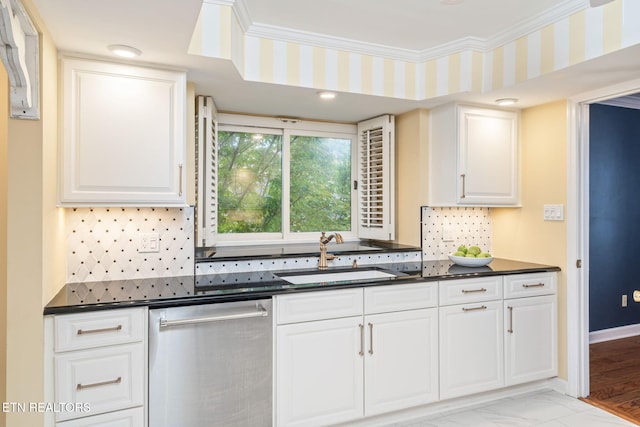 kitchen featuring stainless steel dishwasher, ornamental molding, sink, light hardwood / wood-style floors, and white cabinetry