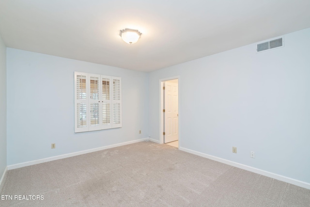 empty room with light colored carpet