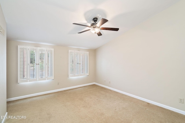 unfurnished room with ceiling fan and light colored carpet