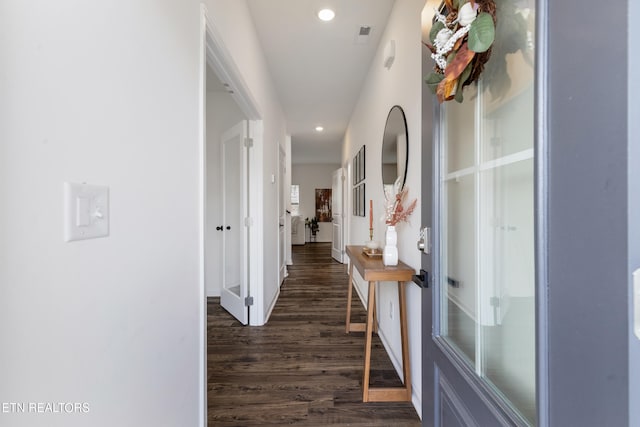 corridor featuring dark hardwood / wood-style flooring