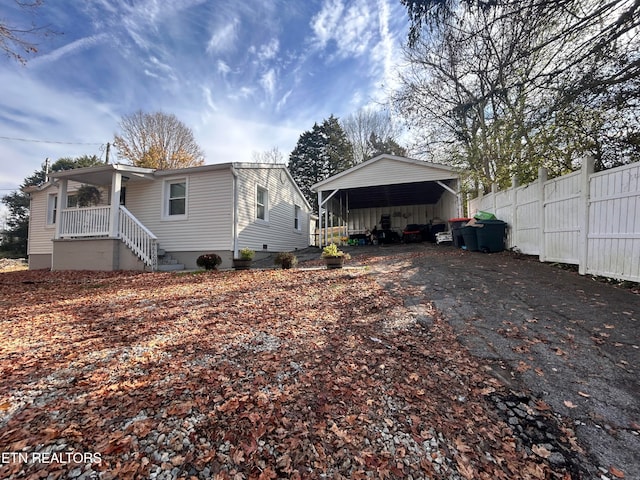 view of property exterior featuring a carport