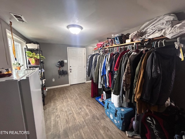 spacious closet featuring hardwood / wood-style floors