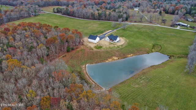 drone / aerial view with a water view and a rural view