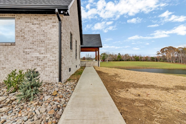 view of property exterior featuring a yard