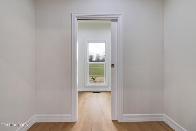 hall with light wood-type flooring