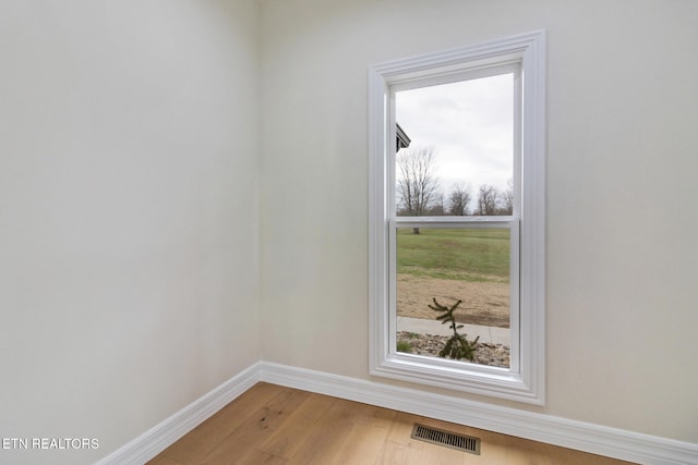 empty room featuring hardwood / wood-style floors