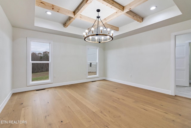 unfurnished room featuring beamed ceiling, light hardwood / wood-style floors, coffered ceiling, and a chandelier