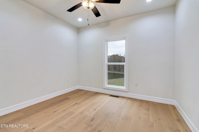 unfurnished room featuring ceiling fan and light wood-type flooring