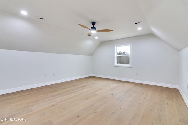 additional living space featuring light hardwood / wood-style floors, ceiling fan, and lofted ceiling