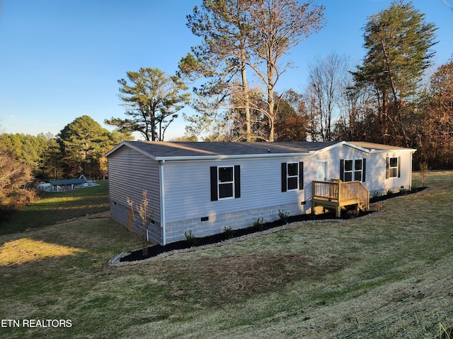 140 N Hillcrest Dr, Spring City, TN 37381 - view of front of property featuring a deck, a front yard, crawl space, and a shingled roof