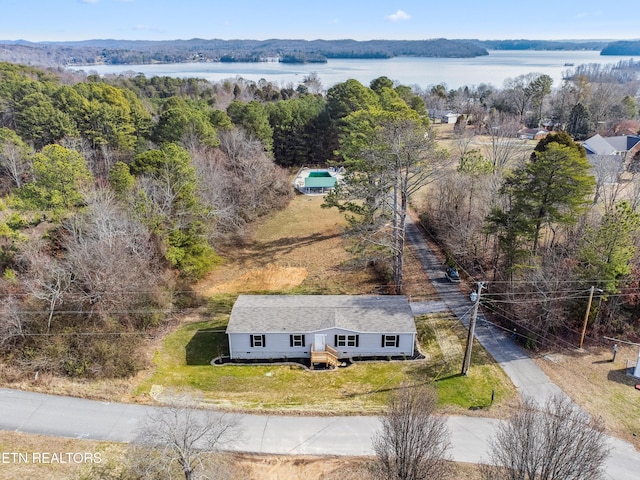 birds eye view of property featuring a water view