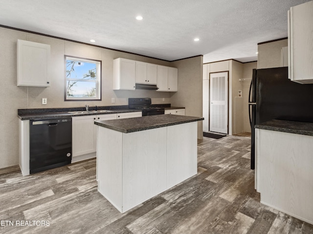 kitchen featuring white cabinets, a center island, black appliances, and dark hardwood / wood-style floors