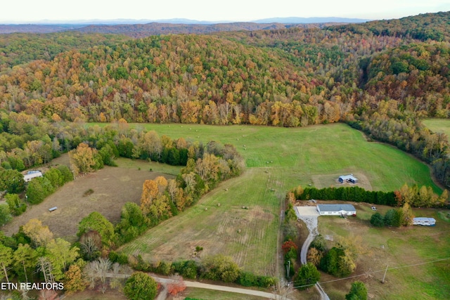 birds eye view of property with a rural view