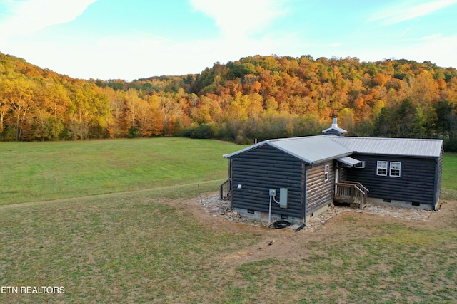 view of outbuilding with a yard