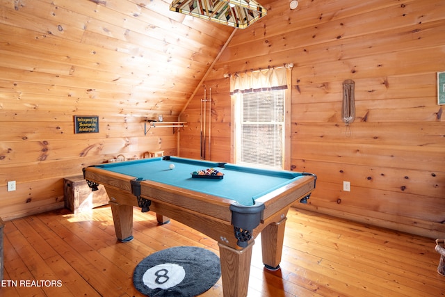 recreation room with wooden walls, light hardwood / wood-style floors, lofted ceiling, and billiards