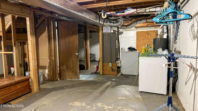 basement with washer and dryer and water heater