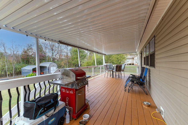 wooden terrace featuring area for grilling